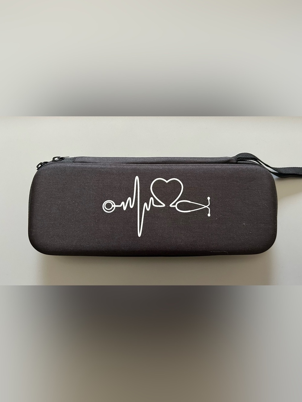 Black Medical-Themed Stethoscope Case with White Heartbeat Graphic